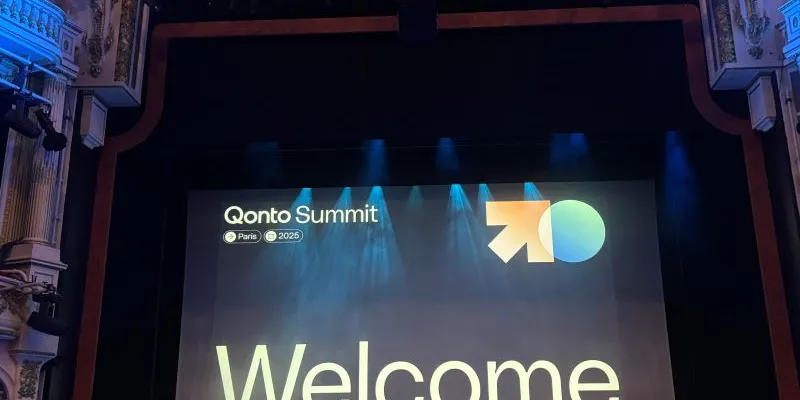 The stage at a Qonto Summit event in Paris, screen reading 'Welcome'