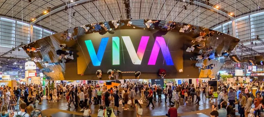 The VIVA sign above the crowded show floor at VivaTech